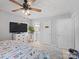 Comfortable bedroom with neutral walls, a large TV, and ensuite bathroom access at 500 Colony Acres Dr, Charlotte, NC 28217