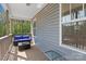 Cozy back porch with comfortable seating, perfect for relaxing and enjoying the outdoors at 539 Morrison Farm Rd, Troutman, NC 28166