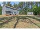 Expansive backyard features a deck with seating and a storage shed at 539 Morrison Farm Rd, Troutman, NC 28166