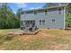 Backyard deck with outdoor seating, a grill, and a peaceful setting at 539 Morrison Farm Rd, Troutman, NC 28166