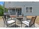 Outdoor living space with a stone fire pit surrounded by comfortable seating on deck at 539 Morrison Farm Rd, Troutman, NC 28166