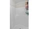 Clean bathroom shower features a white shower curtain, wall mounted caddy, and neutral design at 539 Morrison Farm Rd, Troutman, NC 28166