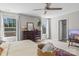 Bright bedroom featuring a large window, dresser and ceiling fan at 539 Morrison Farm Rd, Troutman, NC 28166