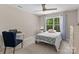 Cozy bedroom with a large window and blue chair and curtains at 539 Morrison Farm Rd, Troutman, NC 28166