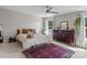 Comfortable bedroom featuring a ceiling fan, large rug and dresser at 539 Morrison Farm Rd, Troutman, NC 28166