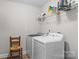 Functional laundry room with modern washer and dryer units at 539 Morrison Farm Rd, Troutman, NC 28166