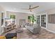 Living room features hardwood floors, neutral walls, ceiling fan, and lots of natural light at 539 Morrison Farm Rd, Troutman, NC 28166