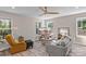 Spacious living room with hardwood floors, neutral walls, ceiling fan, and ample natural light at 539 Morrison Farm Rd, Troutman, NC 28166