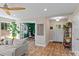 Open concept living room with hardwood floors and neutral walls flowing into office space at 539 Morrison Farm Rd, Troutman, NC 28166