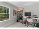 Bright office space with a large window, desk, and shelving unit at 539 Morrison Farm Rd, Troutman, NC 28166