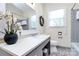 Well-lit bathroom with a white sink, toilet, and decorative accents at 704 Kingman Dr, Charlotte, NC 28217