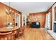 Open living area with hardwood floors, a fireplace, and seamless access to the adjacent dining and living spaces at 704 Kingman Dr, Charlotte, NC 28217