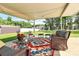 Charming outdoor patio setup with comfortable seating, overlooking the spacious, well-maintained yard at 704 Kingman Dr, Charlotte, NC 28217