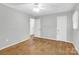 Bright bedroom with hardwood floors, overhead lighting, and neutral walls at 735 Wilbrown Cir, Charlotte, NC 28217