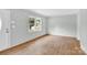 This empty bedroom has hardwood floors and a view to the outside at 735 Wilbrown Cir, Charlotte, NC 28217
