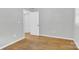 This bedroom offers natural light, neutral walls, and hardwood floors at 735 Wilbrown Cir, Charlotte, NC 28217