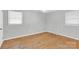 This bedroom offers natural light, neutral walls, and hardwood floors at 735 Wilbrown Cir, Charlotte, NC 28217