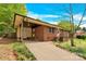 Side view of brick home with a covered side car port and entrance at 735 Wilbrown Cir, Charlotte, NC 28217