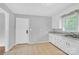 Kitchen featuring tile flooring, white cabinets and stainless steel sink at 735 Wilbrown Cir, Charlotte, NC 28217
