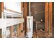 Close up of the water heater and water lines at 735 Wilbrown Cir, Charlotte, NC 28217