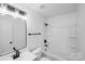 Bright bathroom features tub-shower combination, modern fixtures, and ample lighting at 8027 Bristle Ln, Charlotte, NC 28214