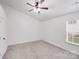 Bright bedroom with neutral carpet and a window at 8027 Bristle Ln, Charlotte, NC 28214