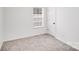 This bright bedroom has neutral carpet and a window at 8027 Bristle Ln, Charlotte, NC 28214