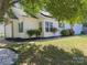Well-maintained home featuring green shutters, lush landscaping, and a freshly cut lawn for curb appeal at 8027 Bristle Ln, Charlotte, NC 28214