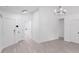 Open concept living room featuring hardwood floors and modern lighting at 8027 Bristle Ln, Charlotte, NC 28214