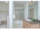 Well-lit bathroom features a shower with glass door and granite countertop vanity at 809 Verney Ln, Charlotte, NC 28226