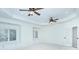 Large bedroom features tray ceiling, two ceiling fans, and two windows with window seats at 809 Verney Ln, Charlotte, NC 28226