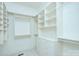 Walk-in closet with custom built-in shelving and drawers at 809 Verney Ln, Charlotte, NC 28226