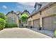 Charming brick home with a three-car garage and a beautiful brick driveway and manicured lawn at 809 Verney Ln, Charlotte, NC 28226