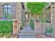 Inviting front entrance featuring a stone path, brick pillars and a wooden front door at 809 Verney Ln, Charlotte, NC 28226