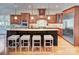 Beautiful kitchen with stainless appliances, hardwood floors, granite counters, and a large island with seating at 809 Verney Ln, Charlotte, NC 28226