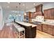 Gourmet kitchen with custom wood cabinets, granite countertops, and stainless steel appliances at 809 Verney Ln, Charlotte, NC 28226