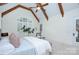 Beautiful main bedroom featuring a large window with shutters and a ceiling fan at 809 Verney Ln, Charlotte, NC 28226