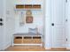 Welcoming mudroom featuring built-in bench with storage and overhead shelving for organizing essentials at 809 Verney Ln, Charlotte, NC 28226