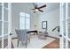 Office featuring french doors, hardwood floors, a ceiling fan, and a large window at 809 Verney Ln, Charlotte, NC 28226