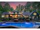 Stunning backyard with a large pool, elegant landscaping, and a covered patio perfect for entertaining at 8400 Prince Valiant Dr, Waxhaw, NC 28173