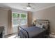 Comfortable bedroom with a large window that allows natural light to fill the room at 8400 Prince Valiant Dr, Waxhaw, NC 28173