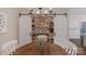 Dining area with sliding barn doors to a pantry, a chandelier, and plenty of storage space at 8400 Prince Valiant Dr, Waxhaw, NC 28173