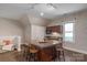 The kitchenette features a central island, a sink, and cabinet storage, perfect for snacks and drinks at 8400 Prince Valiant Dr, Waxhaw, NC 28173