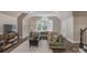 Cozy living room featuring vaulted ceilings, large windows, comfortable seating, and a tranquil atmosphere at 8400 Prince Valiant Dr, Waxhaw, NC 28173