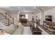 Relaxing living room includes a kitchenette, stairs to main level and stylish decorations for entertainment or unwinding at 8400 Prince Valiant Dr, Waxhaw, NC 28173