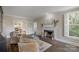 Cozy living room with fireplace and two chairs at 8400 Prince Valiant Dr, Waxhaw, NC 28173