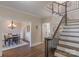 Foyer view with staircase and dining room access at 8400 Prince Valiant Dr, Waxhaw, NC 28173