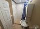 Bathroom with a walk-in shower, pedestal sink, and white subway tile for a clean and classic look at 907 Mcgowan Rd, Shelby, NC 28150