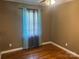 Bedroom featuring hardwood floors, a ceiling fan, and a window with blinds and curtains at 907 Mcgowan Rd, Shelby, NC 28150