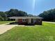 Charming single-story brick home with a well-manicured lawn and a convenient carport at 907 Mcgowan Rd, Shelby, NC 28150